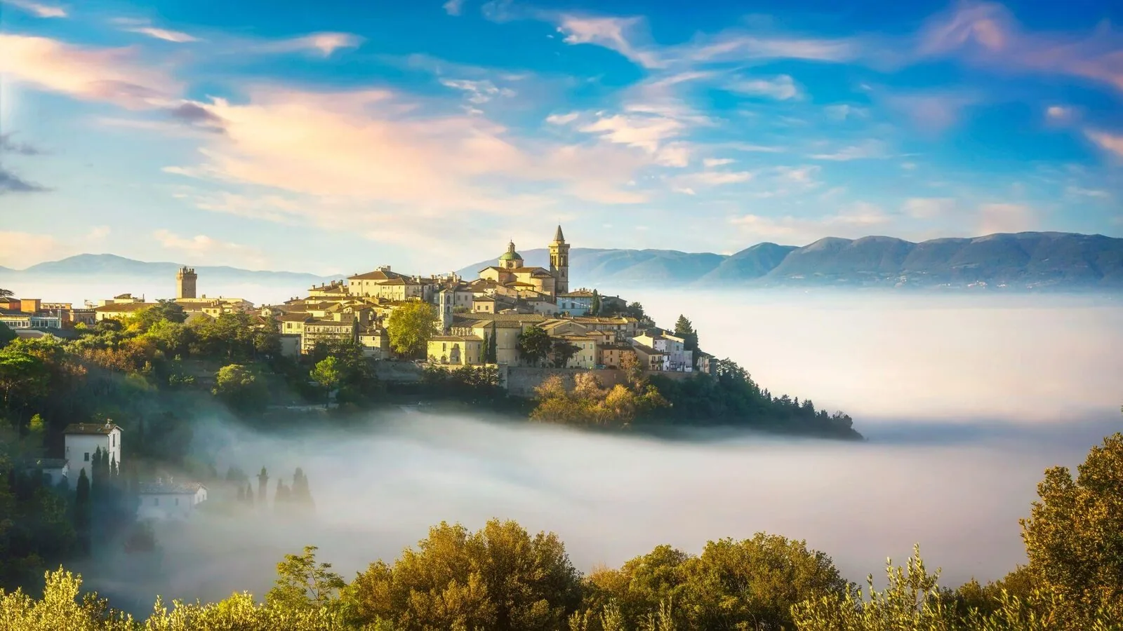 Umbrian hill town in morning mist - where the Lagotto Romagnolo was saved from extinction